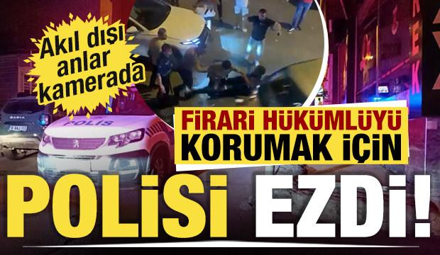 Polisin yakaladığı şüpheliyi korumak için polisi ezdi! Akıl dışı anlar kamerada...