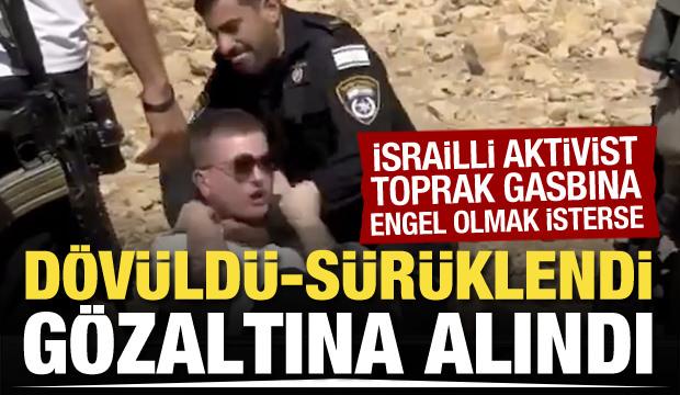 İsrail polisi, Filistin'de toprak gasbına karşı çıkan İsrailli aktivisti dövdü