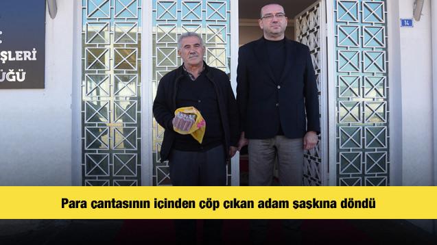 Para &ccedil;antasının i&ccedil;inden &ccedil;&ouml;p &ccedil;ıkan adam şaşkına d&ouml;nd&uuml;