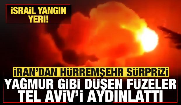 İran'dan İsrail'e H&uuml;rremşehr s&uuml;rprizi! Yağmur gibi d&uuml;şen f&uuml;zeler Tel Aviv'i aydınlattı