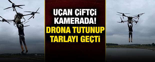 Samsun'da bir &ccedil;ift&ccedil;i, drona tutunarak tarlanın diğer tarafına ge&ccedil;ti