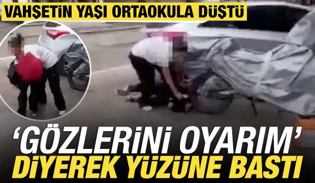 Isparta'da akran zorbalığı kamerada: Yere yatırdığı arkadaşının y&uuml;z&uuml;ne bastı