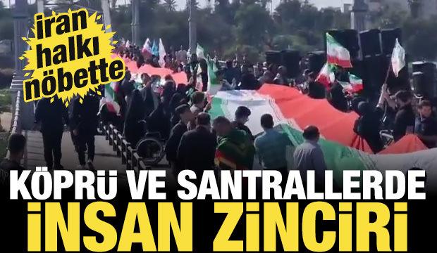 İran halkı n&ouml;bette: K&ouml;pr&uuml; ve santrallerde insan zinciri