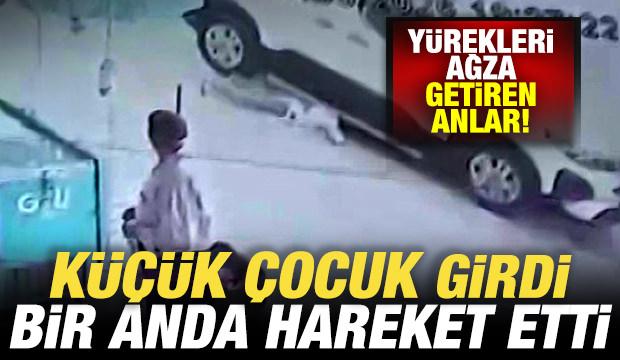 Vatandaş son anda yetişti! Arabanın altına giren &ccedil;ocuk &ouml;l&uuml;mden kıl payı kurtuldu