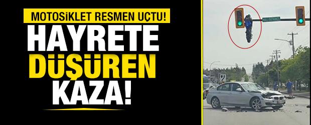 Kanada'da kazaya karışan motosiklet trafik lambasında asılı kaldı