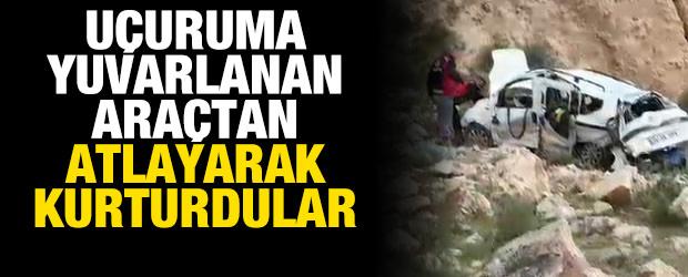 300 metrelik u&ccedil;uruma yuvarlanan ara&ccedil;tan son anda atlayarak kurtuldular