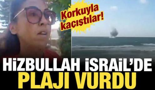 Hizbullah'ın attığı roketlerin denize d&uuml;şmesi plajdaki İsraillilerde korkuya neden oldu