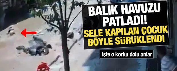 Balık havuzu patladı sokak g&ouml;le d&ouml;nd&uuml;: Minik &ccedil;ocuk akıntıya b&ouml;yle kapıldı!