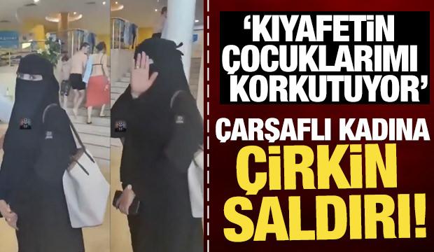 &Ccedil;arşaflı kadına &ccedil;irkin saldırı! 'Kıyafetin &ccedil;ocuklarımı korkutuyor'
