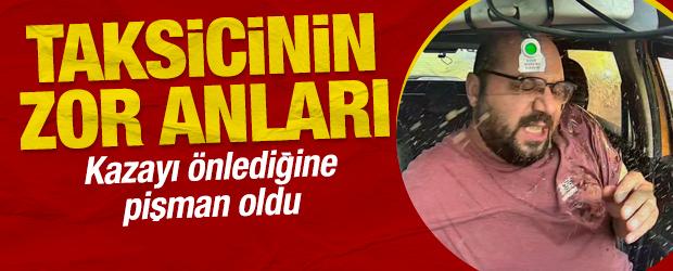 Kazayı &ouml;nleyen taksi s&uuml;r&uuml;c&uuml;s&uuml;n&uuml;n a&ccedil;ık penceresinden &ccedil;amurlu su sı&ccedil;rattı