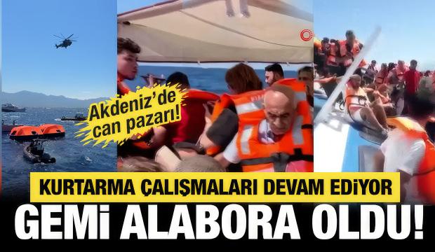 Girne a&ccedil;ıklarında alabora olan gemideki yolcuları kurtarma &ccedil;alışmaları kameralara yansıdı