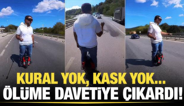 Trafikte akılalmaz anlar: Tek tekerlekli scooter ile tırların sağından ge&ccedil;ti