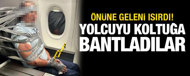 U&ccedil;akta taşkınlık yapan yolcuyu koli bandıyla bağladılar