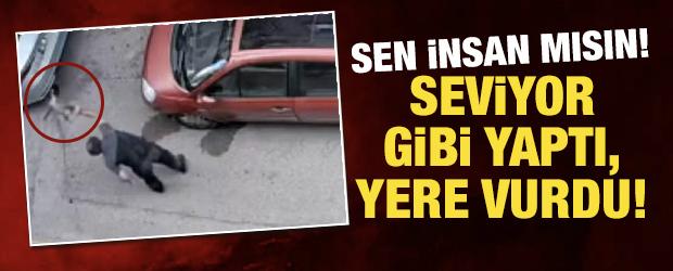 Bursa'da kan donduran anlar: Kucağındaki kediye acımasızca şiddet uyguladı