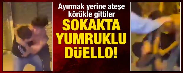 Sokak ortasında yumruklu d&uuml;ello: Arkadaşları ayırmak yerine ateşe k&ouml;r&uuml;kle gitti